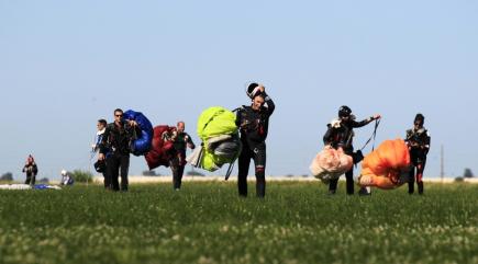 Watch 164 jumpers smash world record in skydiving with a giant flower formation