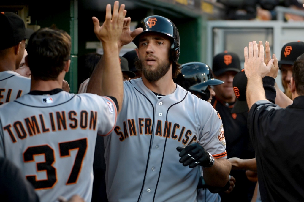 Giants&#39 Madison Bumgarner Giants&#39 Madison Bumgarner is congratulated by teammates after hitting a tworun home run against the Pirates in the second inning night at PNC Park