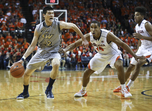 Then-freshman Yuta Watanabe drives toward the paint in GW's game against Virginia last November. The Colonials second game of the home-and-home agreement will be broadcast on ESPN2 as ESPN's first men's college basketball game of the 2015-1