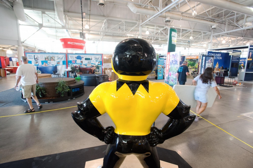 Herky's back looking out onto other fair exhibits