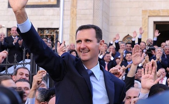 Syrian President Bashar al Assad waving to an admiring crowd