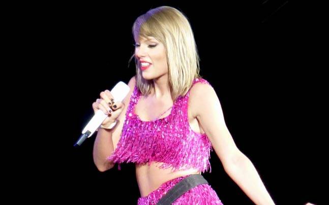 Taylor slipped into a sparkly pink fringe number for the night