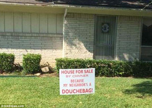 Striking This'For Sale sign which sits in Lisa Price's front yard in Farmers Branch in Dallas County Texas informs passersby that she is selling her family home of 12 years because her neighbor is a'douchebag