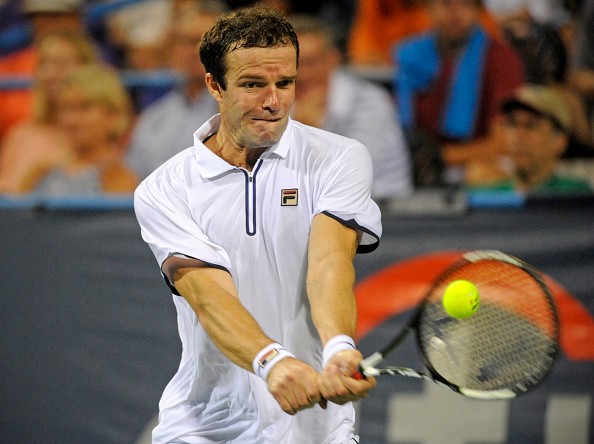 Teymuraz Gabashvili plays a backhand in his win over Andy Murray