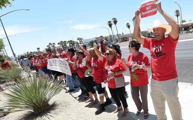 Culinary Workers Union Local 226 members protest a July appearance by Wisconsin Gov. Scott Walker at Red Rock Harley Davidson in Las Vegas. Walker is routinely met by protesters at his campaign stops across the country