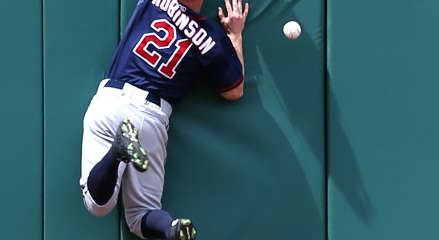 Minnesota Twins left fielder Shane Robinson cannot make a play on a double by Cleveland Indians&#39 Chris Johnson during the second inning of a baseball game Sunday Aug. 9 2015 in Cleveland