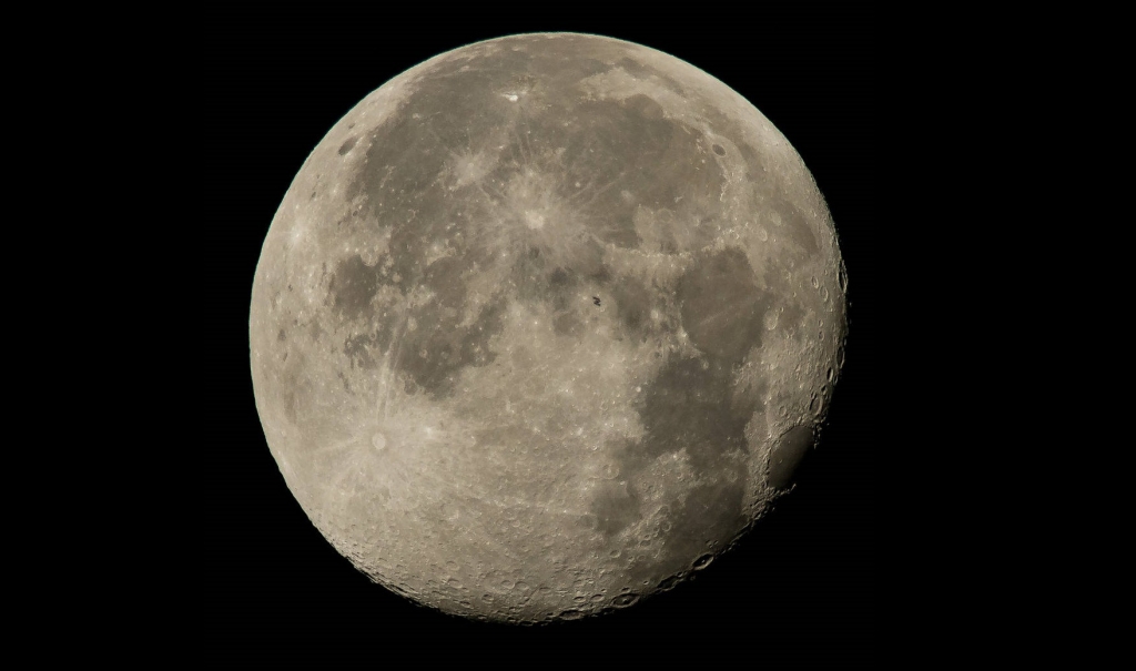 The International Space Station crosses the Moon. Image credit