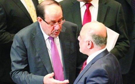 The Iraqi Vice President Nouri al Maliki talks with Iraqi Prime Minister Haidar al-Abadi