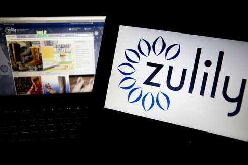 The Zulily Inc. website and logo displayed on laptop computers