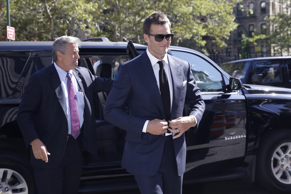 New England Patriots quarterback Tom Brady sets to pass during training camp in Foxborough Mass. Brady missed Tuesday’s practice to prepare for his court case Wednesday in Manhattan