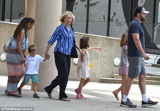 The more the merrier! Ben was joined by his mother Christine a nanny and his three children in Atlanta on Friday