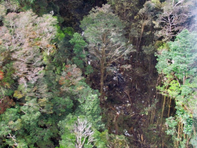 The wreckage from Trigana Air ATR 42-300 twin-turboprop scattered among trees in the mountainous area of Oksibil district in Papua