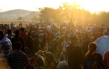 Thousands of migrants at Greek border push past police into Macedonia