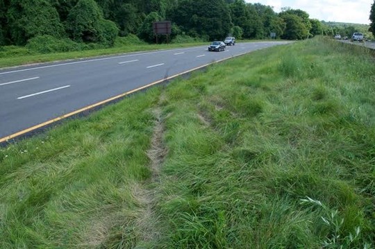 A look at the tire marks and tracks in the northbound lane where the BMW SUV exited into the center median struck an earth embankment and became airborne into the southbound lanes