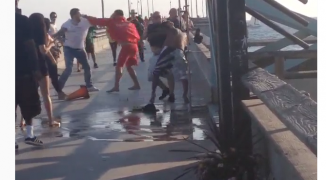 Three people were taken into custody today after a lifeguard was attacked at Venice Beach