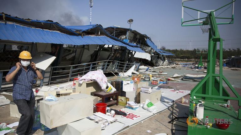 Firefighter rescued from blast zone in China's Tianjin port