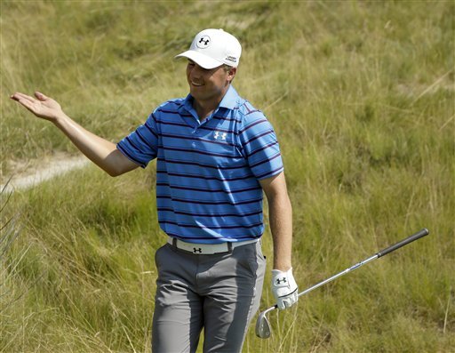 Jordan Spieth reacts after making his bunker shot on the 18th hole during the second round of the PGA Championship golf tournament Friday Aug. 14 2015 at Whistling Straits in Haven Wis