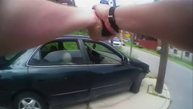 University of Cincinnati police officer Ray Tensing's body camera shows his handgun drawn as he and another officer approach a car that came to a stop after driver Samuel Dubose was pulled over and shot during a traffic stop in Cincinnati Ohio