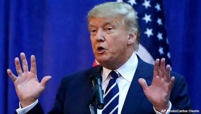 Republican presidential candidate Donald Trump speaks to the media before addressing a GOP fundraising event Tuesday Aug 11 2015 in Birch Run Mich. at the Lincoln Day dinner of the Genesee and Saginaw County Republican parties