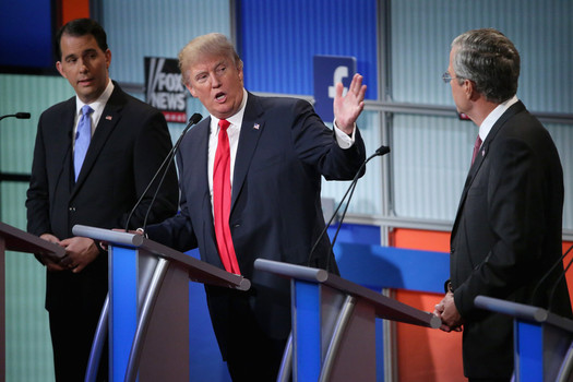 Republican presidential candidates Wisconsin Gov. Scott Walker Donald Trump and Jeb Bush participate in the first prime-time presidential debate hosted by FOX News and Facebook at the Quicken Loans Arena