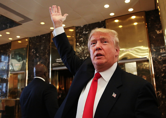 NEW YORK NY- JULY 22 Donald Trump greets supporters tourists and the curious after taping an interview with Anderson Cooper at a Trump owned building in mid-town Manhattan