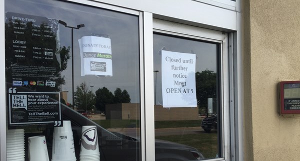 Sign on the Taco Bell's drive-thru window says'Closed until further notice... Open at 5 on the morning of Tuesday Aug. 4 2015