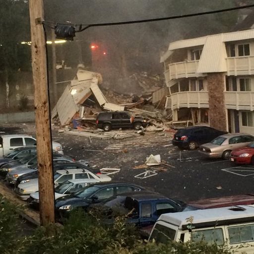 Debris rests on the ground after a portion of Motel 6 exploded just after the business had been evacuated due to reports of a gas leak Tuesday Aug. 18 2015 in Bremerton Wash. Manager Tonya Hinds said in a telephone interview that a passerby had come