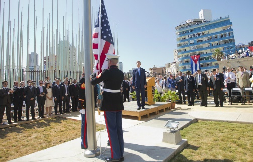 US Secretary of State John Kerry, stands with other dignitaries as members of the US Marines raise the US flag over the newly reopened embassy in Havana Cuba on August 14