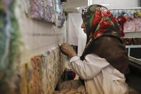 An Iranian woman worked on a carpet at Tehran’s Cultural and Artistic Carpet Foundation of Rassam Arabzadeh