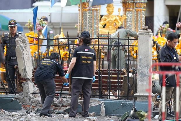 Police teams were deployed to the blood-splattered site early on Tuesday some wearing white gloves and carrying plastic bags searching for clues