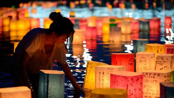 Paper lanterns are lit in rememberance for victims of the 1945 atomic bombing of Hiroshima