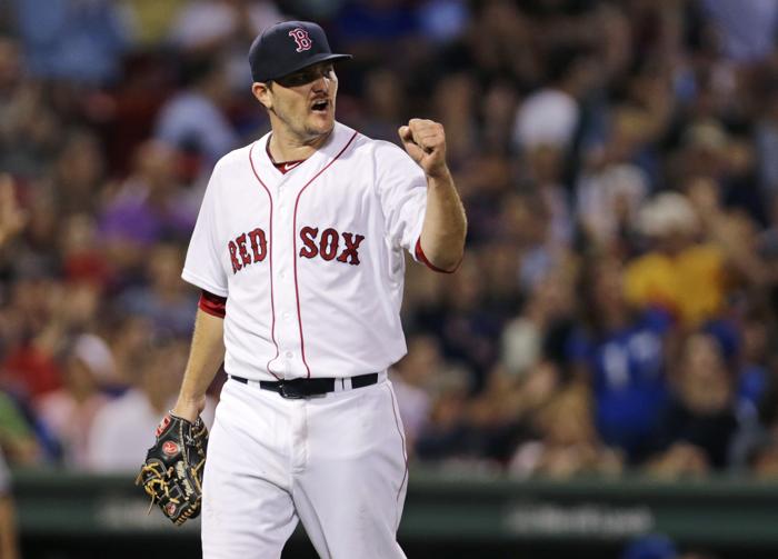 Boston Red Sox starting pitcher Wade Miley pumps his fist after Mookie Betts snagged a a line drive by Kansas City Royals&apos Alex Rios to end the top of the seventh inning of a baseball game at Fenway Park in Boston Thursday Aug. 20 2015. (AP