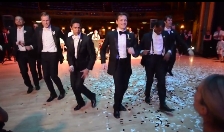 Watch groom groomsmen surprise bride with epic 8-minute dance routine