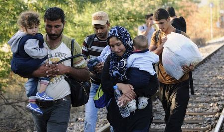 Macedonian riot police officers clash with migrants on the border line with Greece near the train station of Idomeni northern Greece