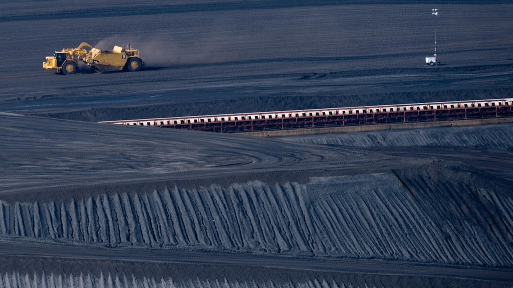 A coal scraper machine works on a pile of coal at American Electric Power's Mountaineer coal power plant in 2009 in New Haven W. Va. The state in which coal mining is a major industry is one party planning to sue the Environmental Protection Agen