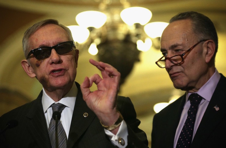 Sen. Harry Reid left the Senate minority leader and his likely successor Sen. Charles Schumer at a news briefing in Washington D.C. Feb. 24 2015. Reid is supporting the Iran deal and Schumer said he will vote against