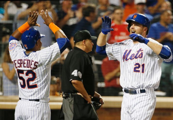 New York Mets Yoenis Cespedes  greets New York Mets Lucas Duda at the plate after scoring on Duda's third-inning two-run home run during a baseball game against the Washington Nationals in New York Sunday Aug. 2 2015