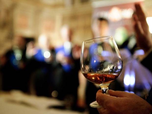 Woman drinks £130 bottle of cognac after being told she could not take it on