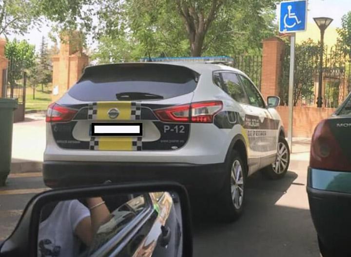 Woman fined under 'gag law' for posting pic of Spanish cop car in handicapped spot