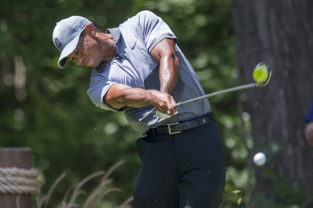 Tiger Woods reacts after he completes his round on the 18th green during the second round of the Wyndham Championship at Sedgefield Country Club on in Greensboro