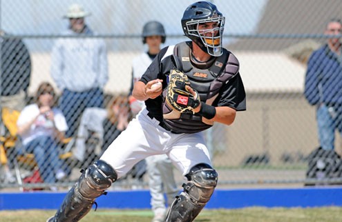 Grandview catcher Greg Bird makes the force at the plate and fires to first to try and get the double play against visiting Eaglecrest