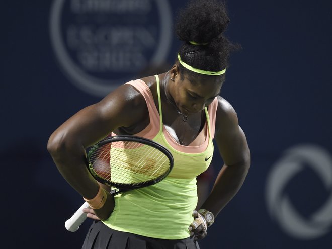 Serena Williams of the United States reacts in the third set against Belinda Bencic of Switzerland during the Rogers Cup semifinal tennis tournament Saturday Aug. 15 2015 in Toronto. MANDATORY CREDIT