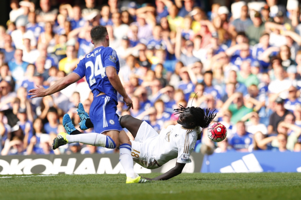 Swansea's Bafetimbi Gomis is brought down in the penalty area resulting in a penalty to Swansea and a red card for Chelsea's Thibaut Courtois. – Reuters pic