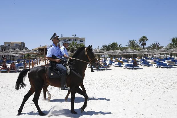 Mounted police officers patrol on the beach at Sousse following the June attack
AP