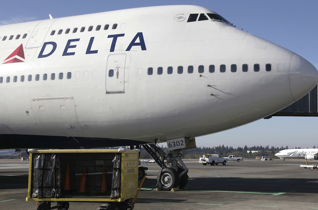 Delta Air Lines airplane is parked at Seattle Tacoma International Airport in Seattle. Delta reports quarterly earnings on Wednesday