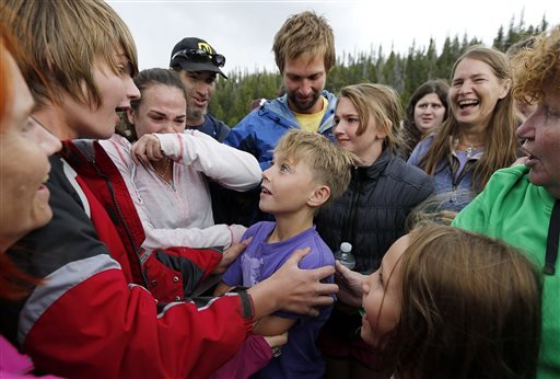 Malachi Bradley center smiles at his brother Levi as he is reunited with his family Monday Aug. 24 2015 in Uintah County Utah after being lost near the Wyoming border on Sunday.  SALT LAKE TRIBUNE OUT MAGS OU