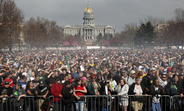 98579568-marijuana-smoke-rises-from-a-smoking-crowd-april-20-2010