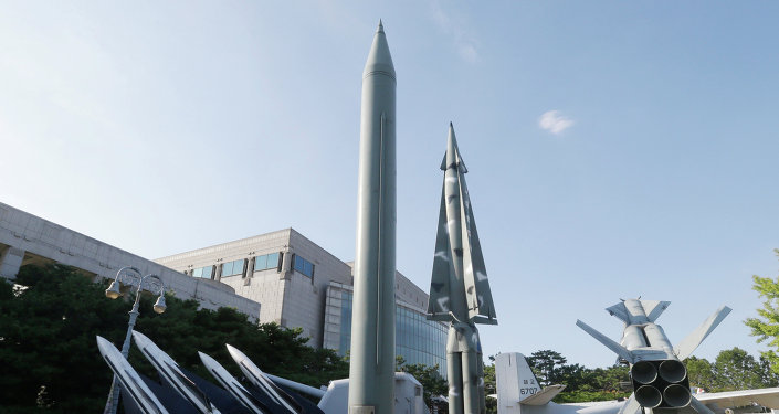 Visitors looks at models of North Korea's Scud-B missile center left and other South Korean missiles on display at the Korea War Memorial Museum in Seoul