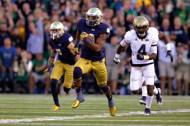 Notre Dame’s C.J. Prosise sprints past Georgia Tech’s Jamal Golden for a second-half TD