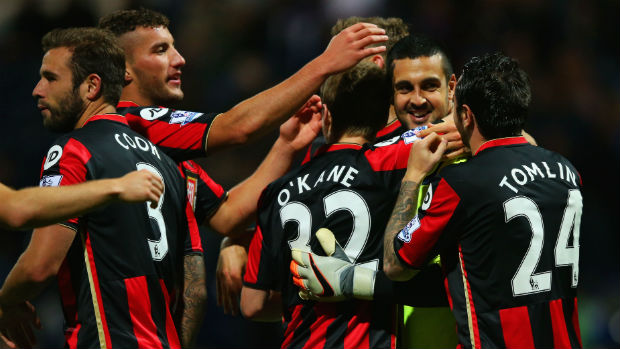 Bournemouth goalkeeper Adam Federici is congratulated by teammates after his shoot-out heroics